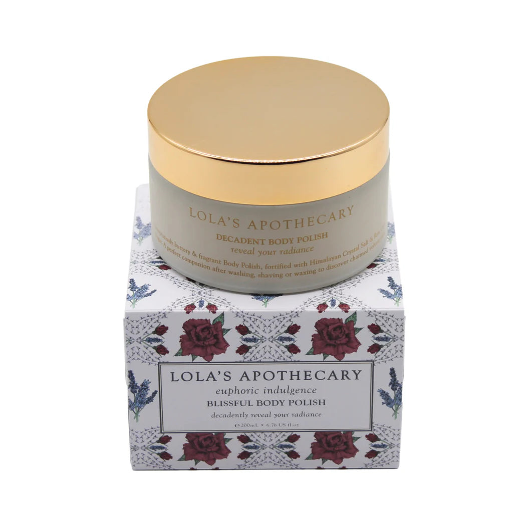 Jar of Euphoric Indulgence body polish on top of a floral gift box