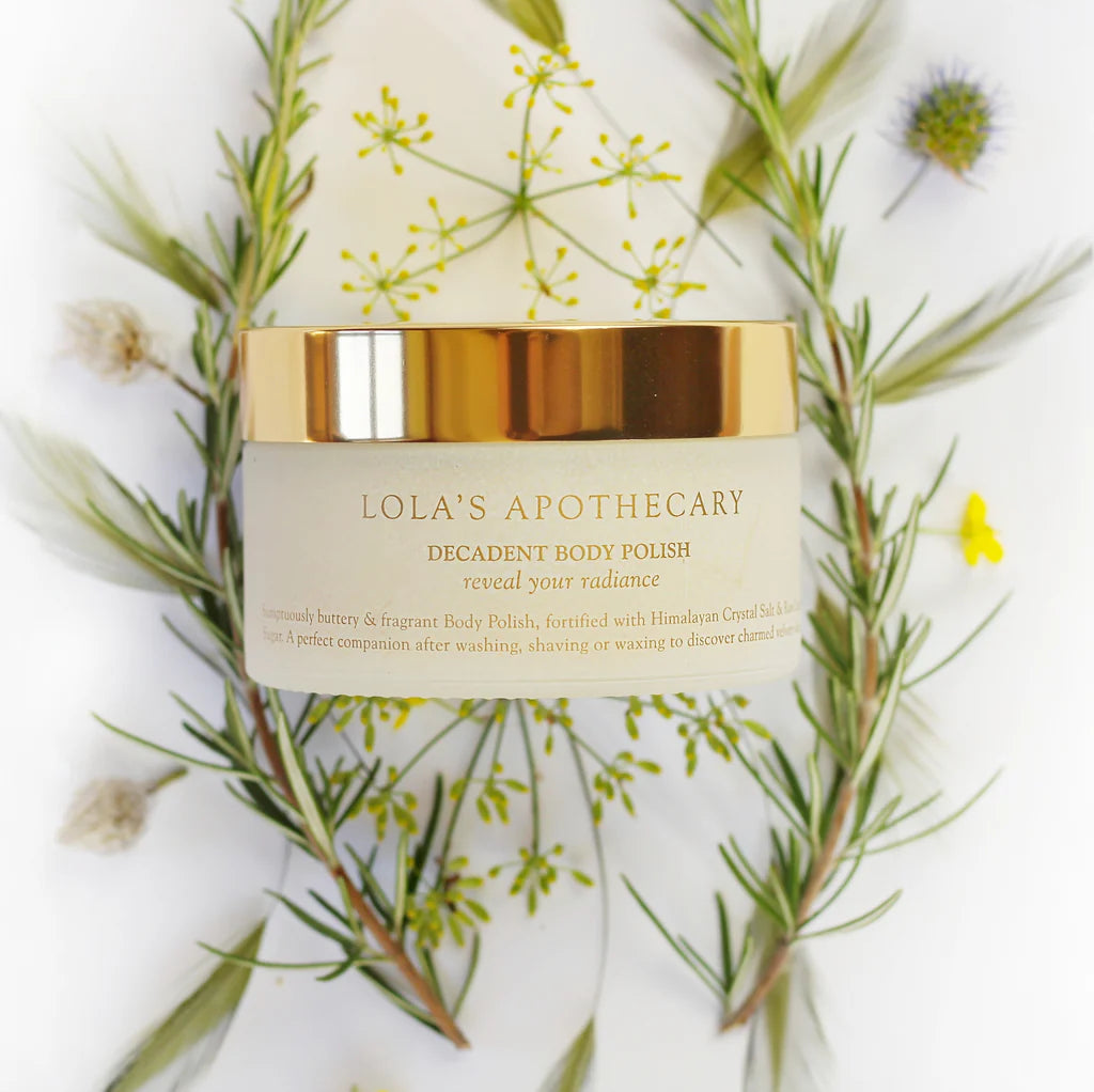 A jar of Breath of Clarity uplifting body polish scrub with eucalyptus leaves
