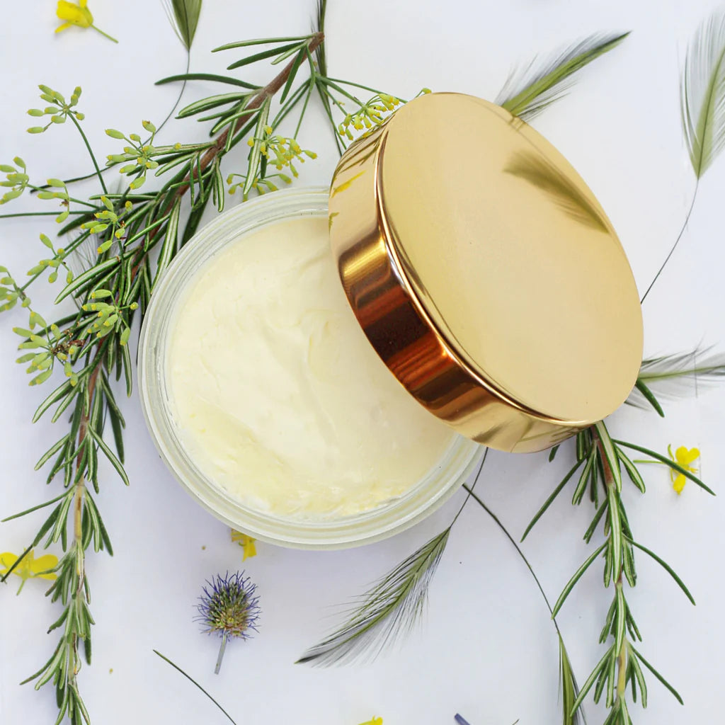 Open jar of Breath of Clarity uplifting body souffle cream with eucalyptus leaves 