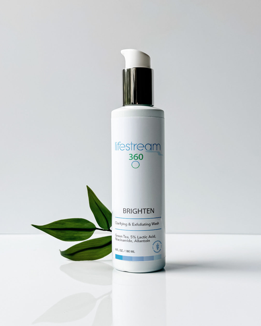 Full size bottle of Brighten green tea facial cleanser with a white background