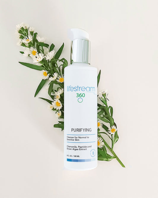 Lifestream 360 Purifying face cleanser bottle with flowers on a light background