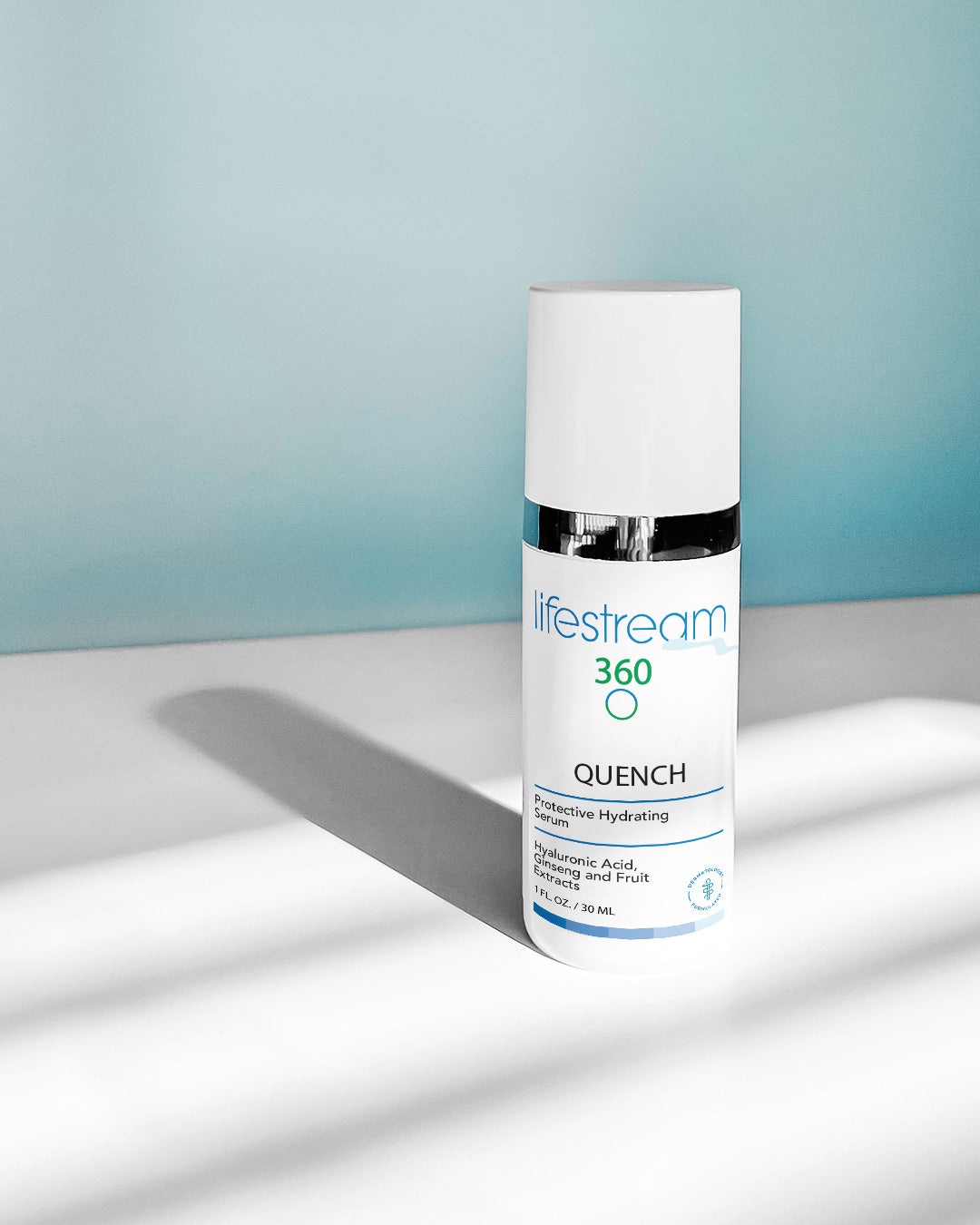 Bottle of face firming serum labeled "Quench" on a light surface with a blue gradient background