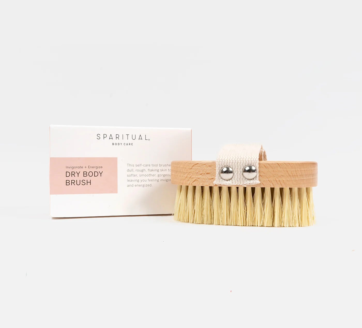 Dry body brush with packaging on a white background