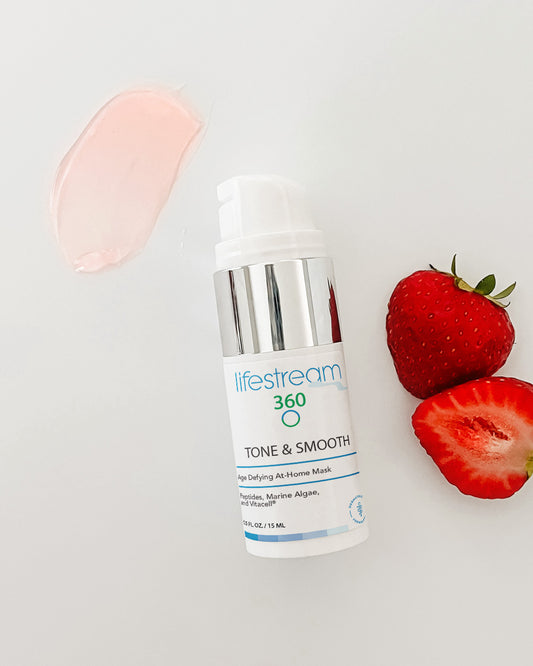 Lifestream 360 anti aging gel mask bottle with strawberries on a light gray background