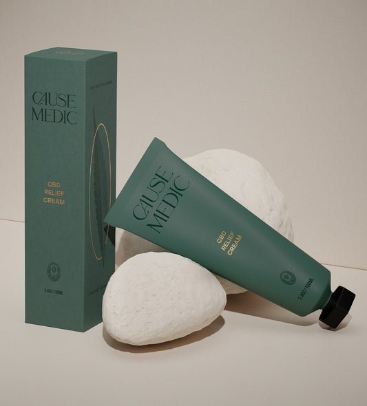 Travel size Cause Medic CBD Relief Cream packaging with a tube and box on a neutral background